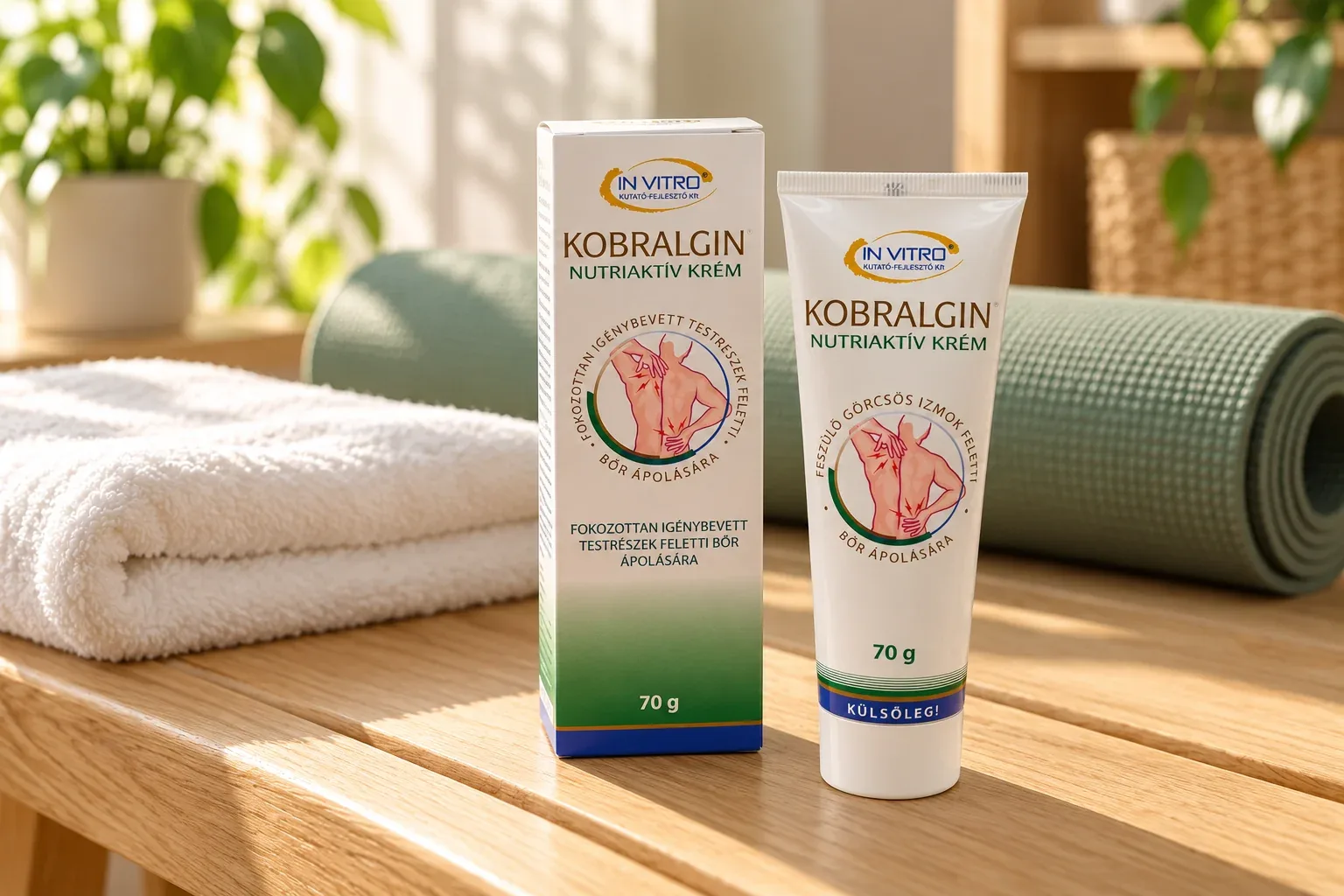 Uzavretá tuba Kobralgin 70 g so škatuľkou pri uteráku a podložke na cvičenie